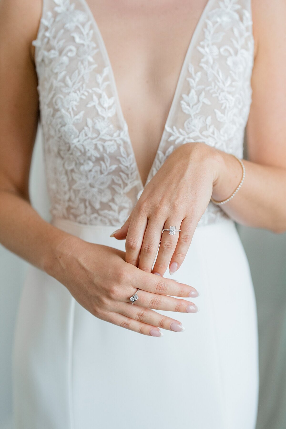 bride holds her hands together to show off her wedding ring captured by Columbus wedding  photographer