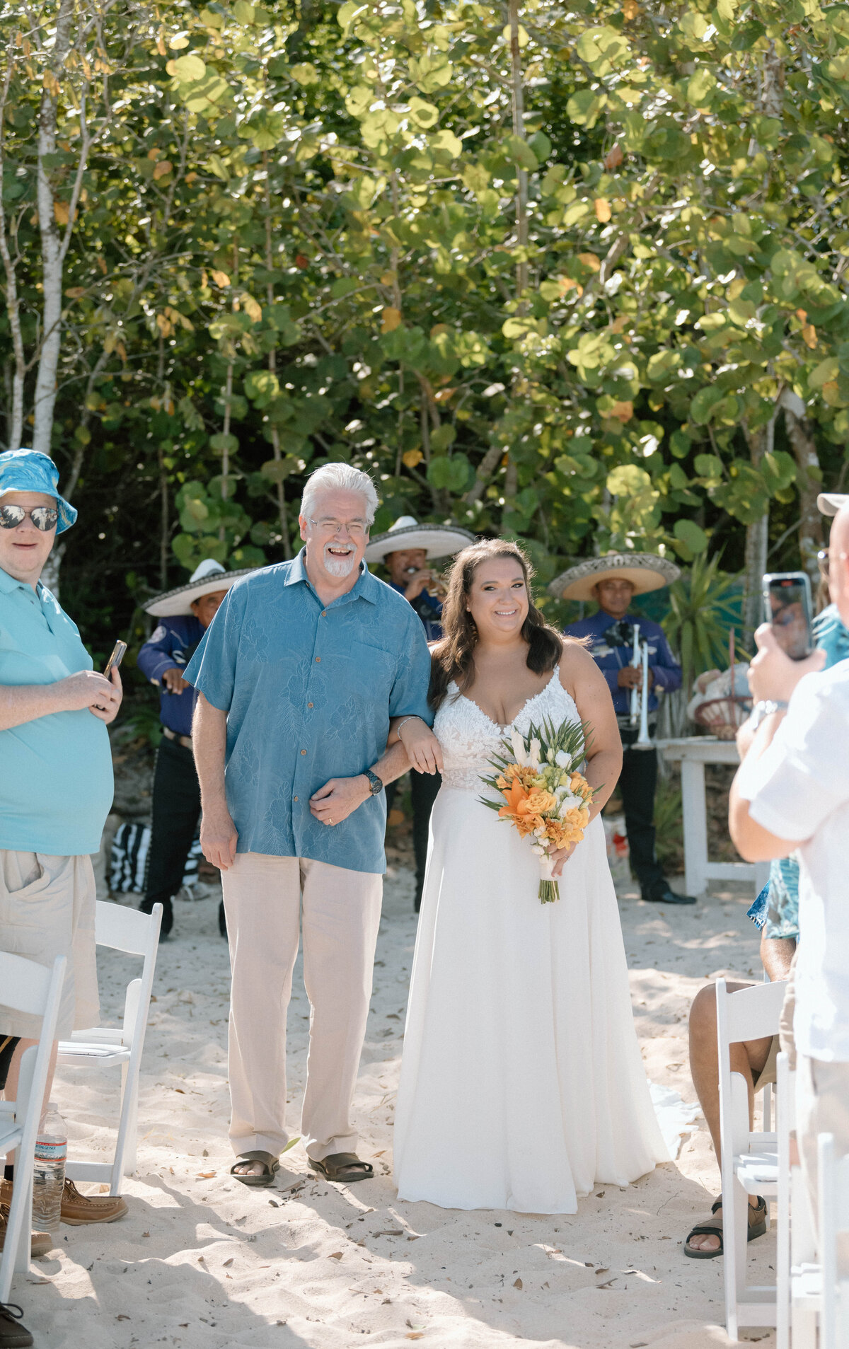 a father walks his daughter down the aisle in Cozumel