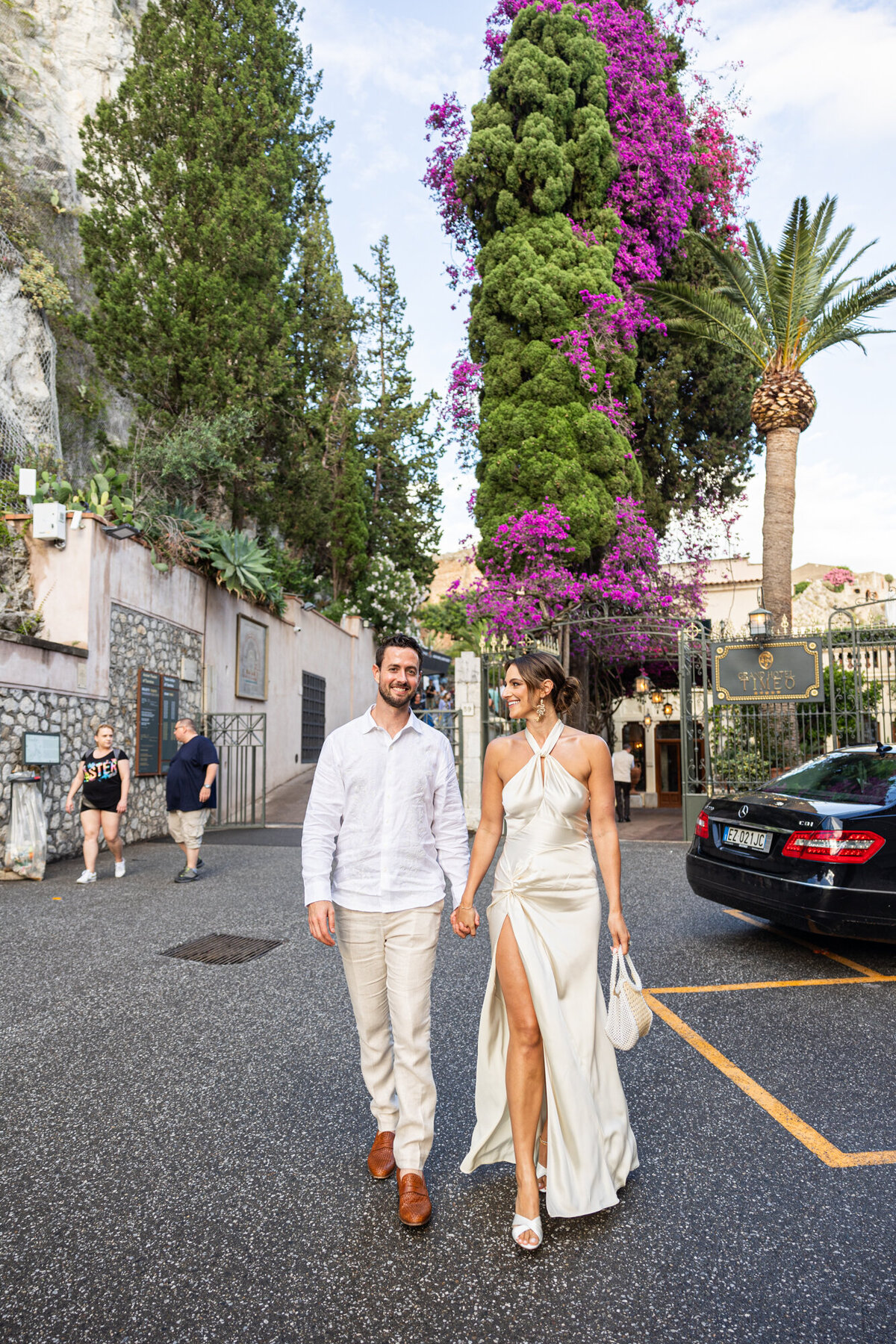 Bride and groom walking hand in hand