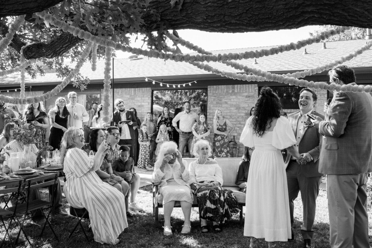 guests-watch-backyard-ceremony
