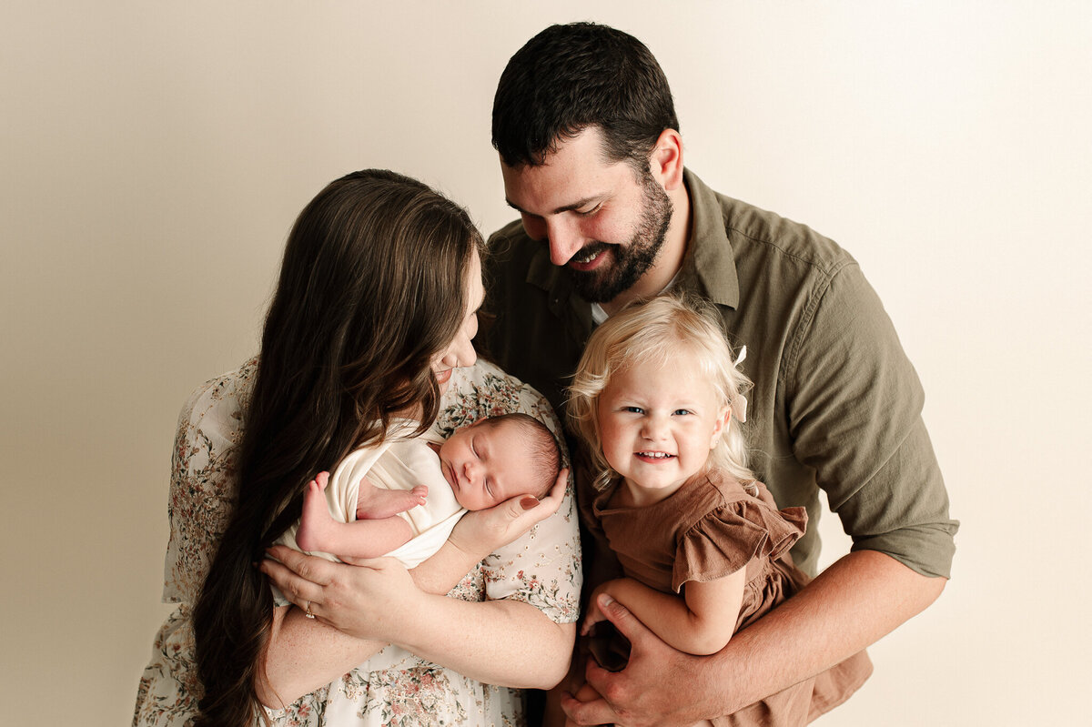 Family with newborn and toddler session in studio