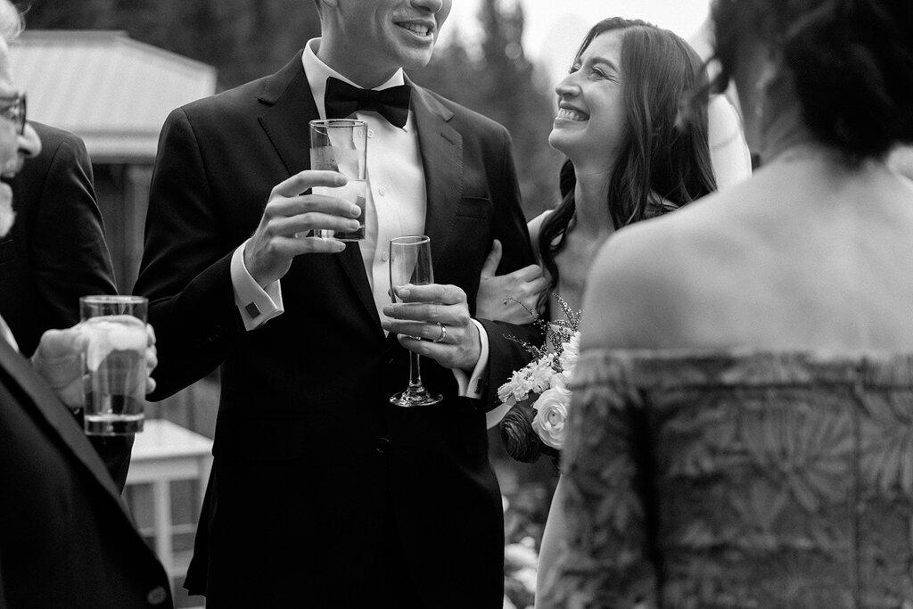 Bride and groom drinking and enjoying themselves during wedding reception by Court Amber Photography, joyful and adventurous wedding photographer in Calgary, Alberta. Featured on the Bronte Bride Vendor Guide.