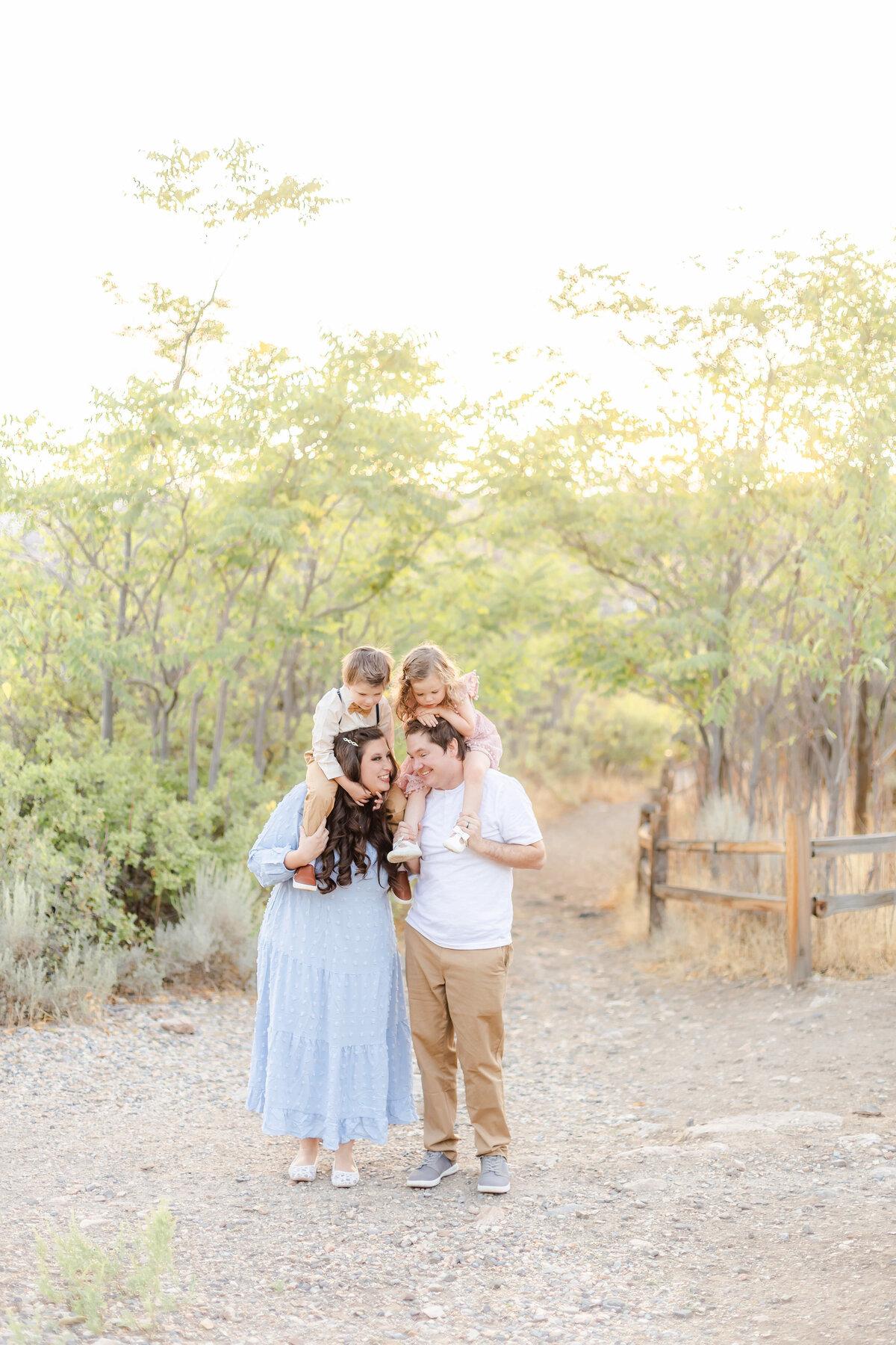 Utah family photography session with parents and children outdoors, captured by a professional Provo Utah photographer specializing in natural, candid, and timeless portraits. Taken at Lambert Park in Alpine, Utah.