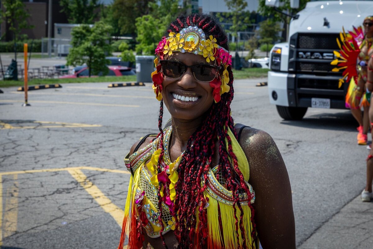 Toronto caribbean carnival parade masquerader in costume with Sunlime Mas, the number 1 medium size band at Toronto Carnival.