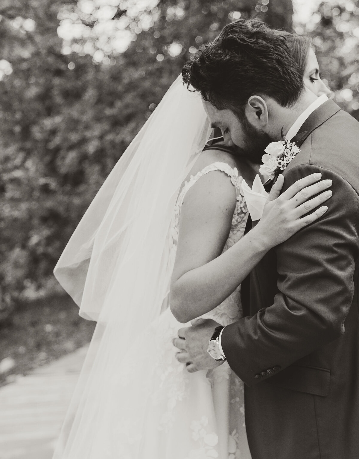 bride and groom embrace during first look