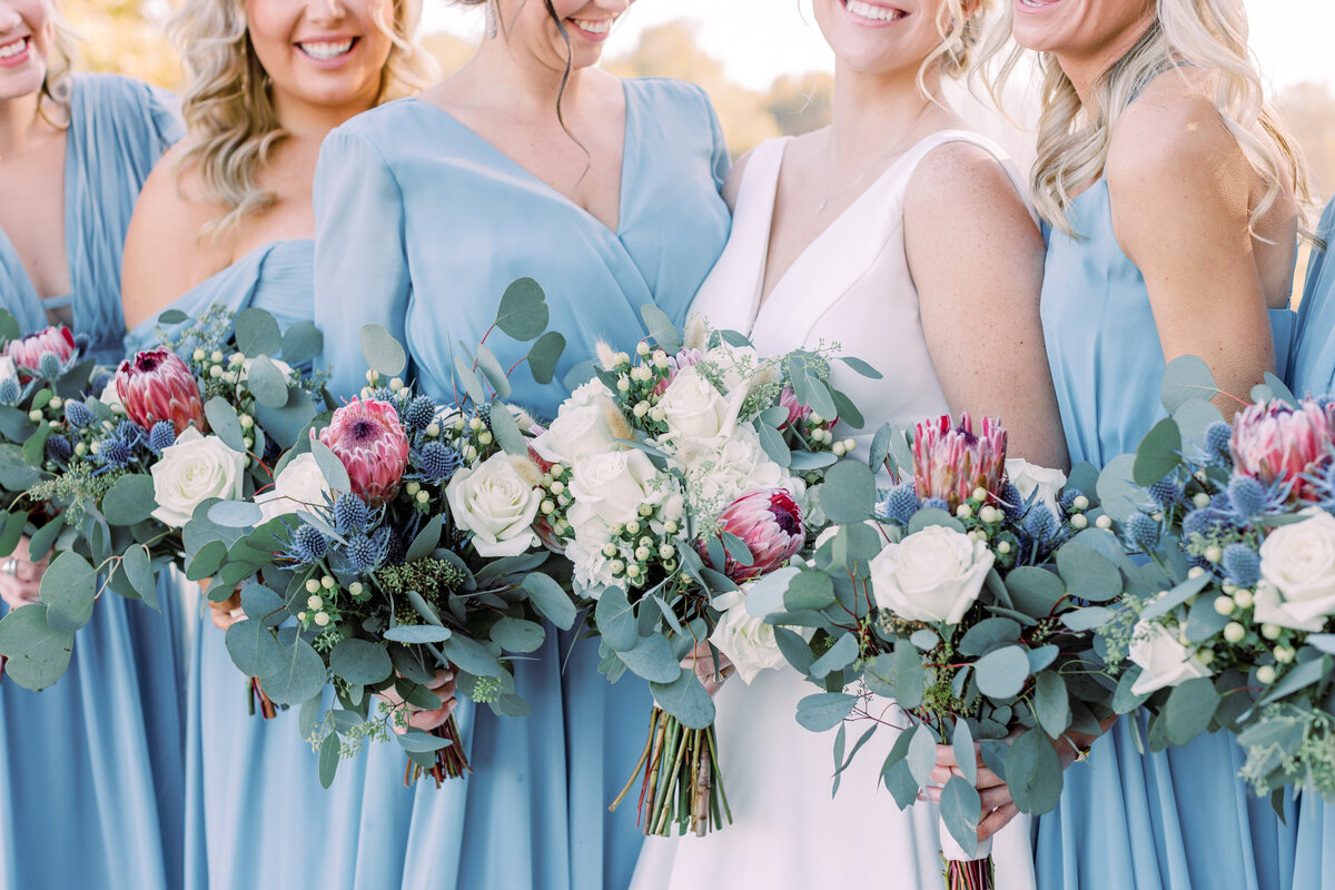 bride and bridesmaids  with bouquets
