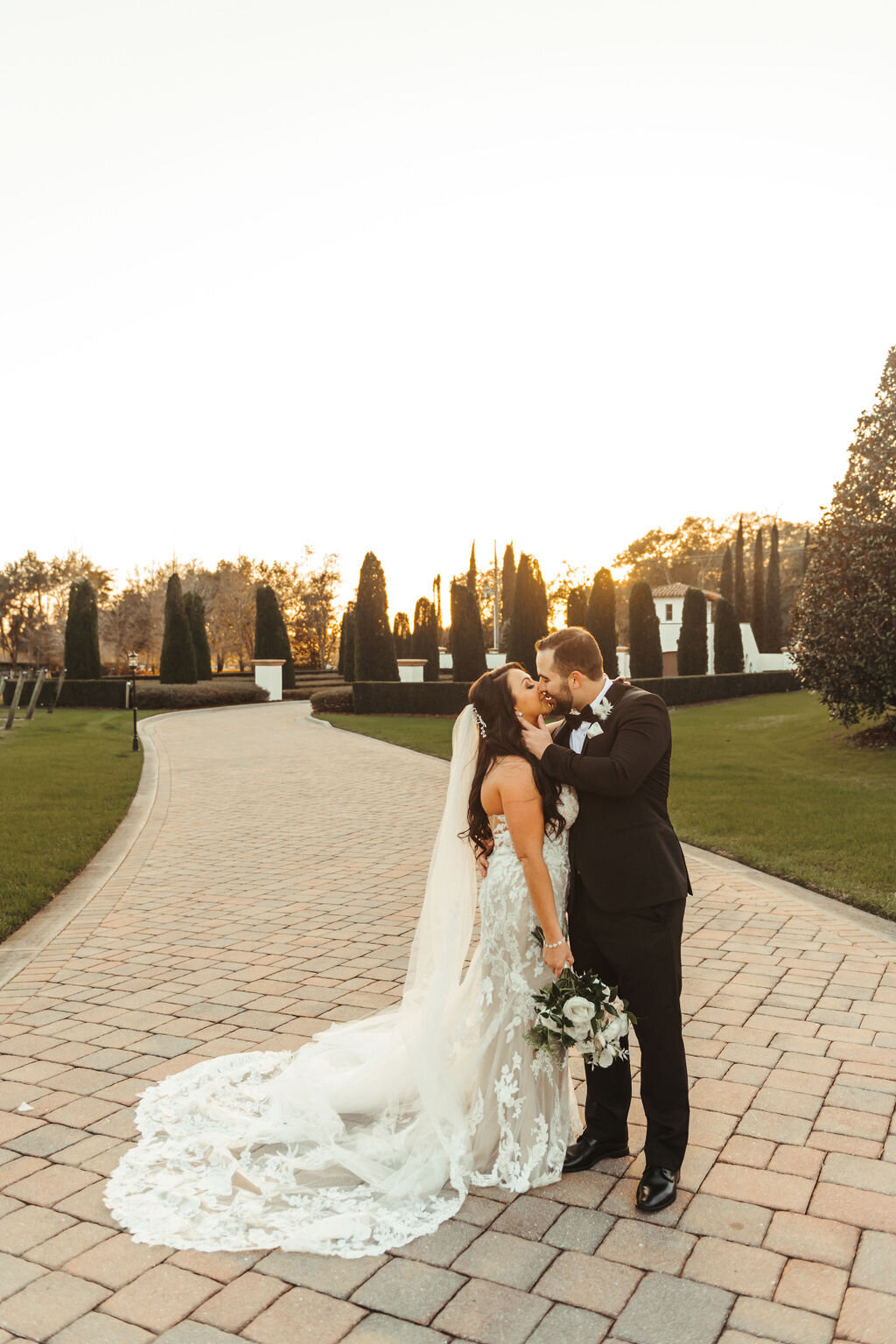 14 - Mision Lago Estate Wedding Bride & Groom Kissing - Tampa Bay Wedding Planner