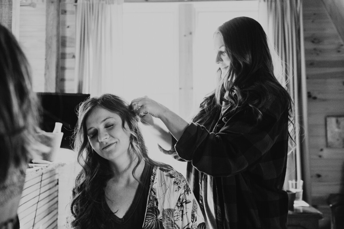 Sarah's sister adds the finishing touches to her hair.