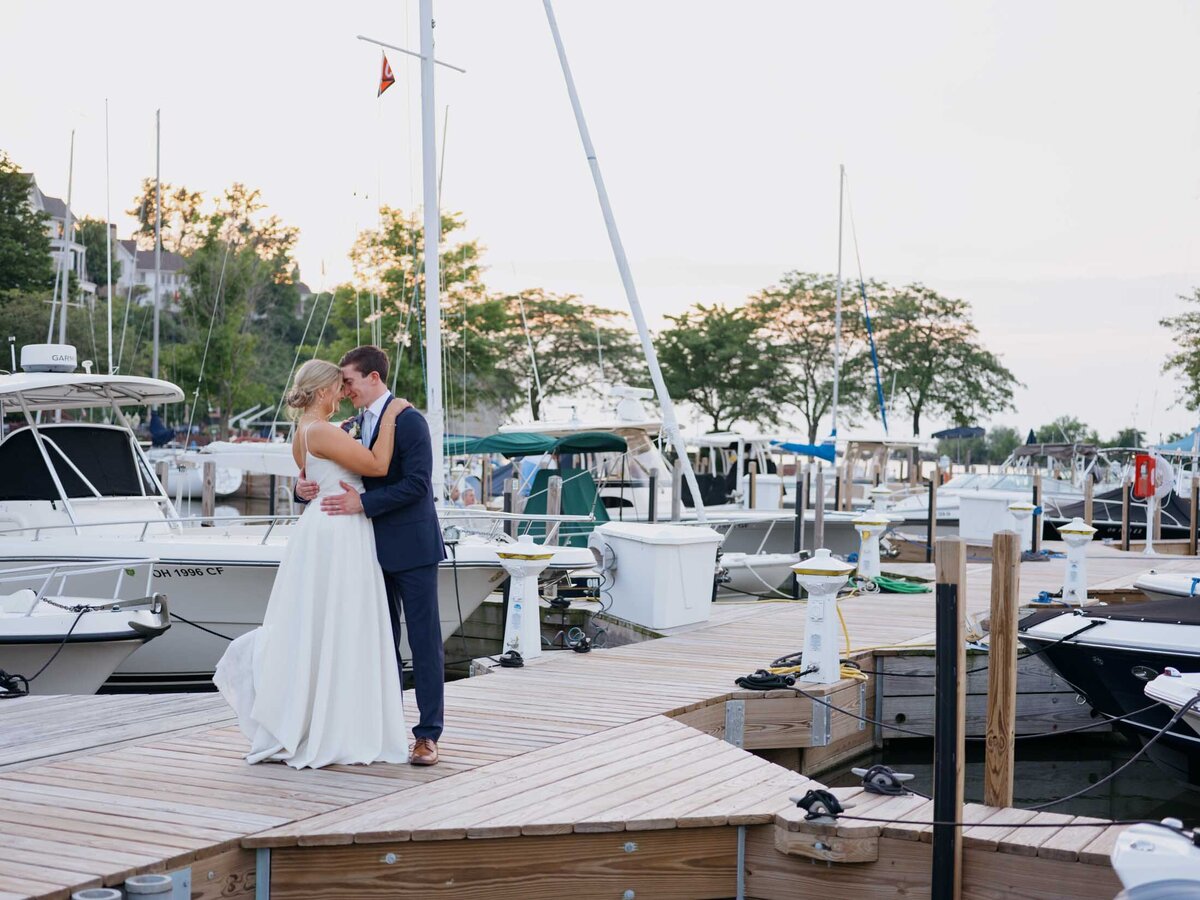 Bride and groom sunset photo on the dock at Cleveland Yachting Club