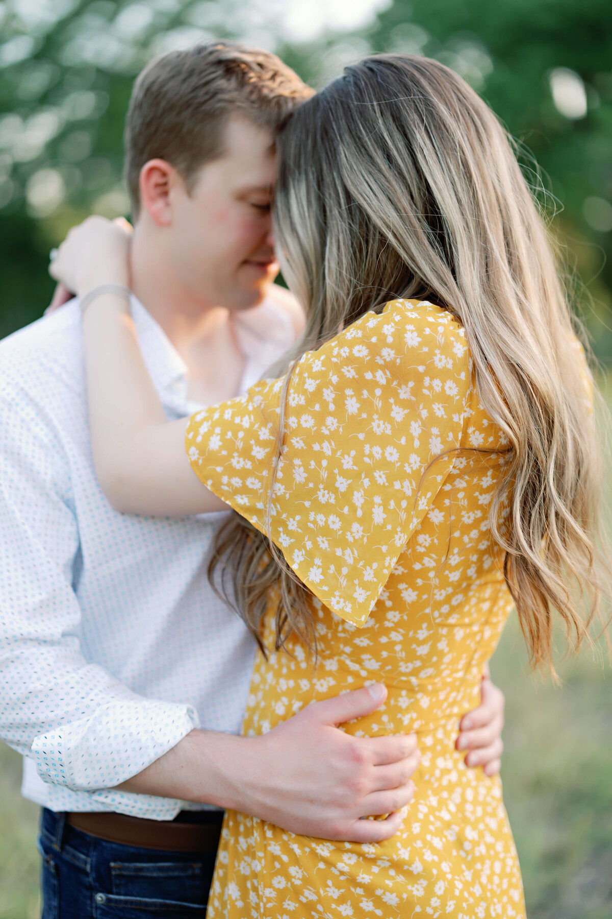 sunset engagement photos in a field