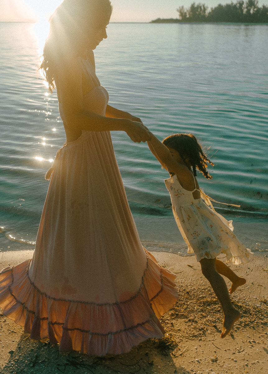 family photos with mom and daughter on beachside