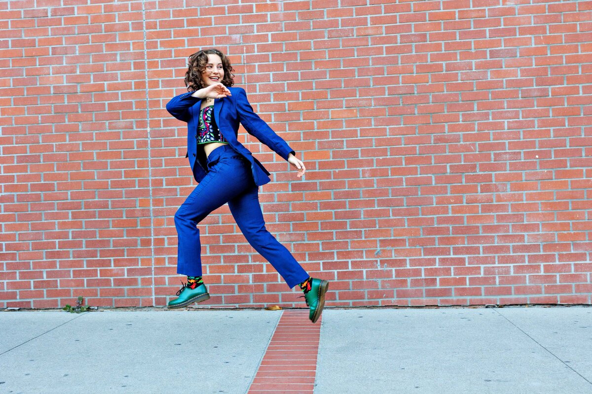 Fashionable senior picture of girl in blue suit in Los Gatos