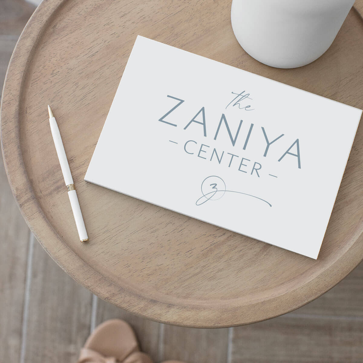 Wellness center branded note card on table