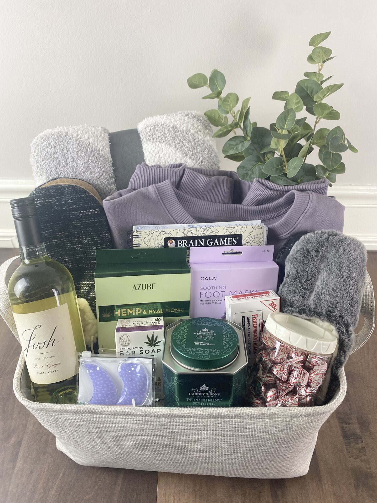 Sympathy Care Package Inspiration blanket, wine, spa items, plant, chocolates