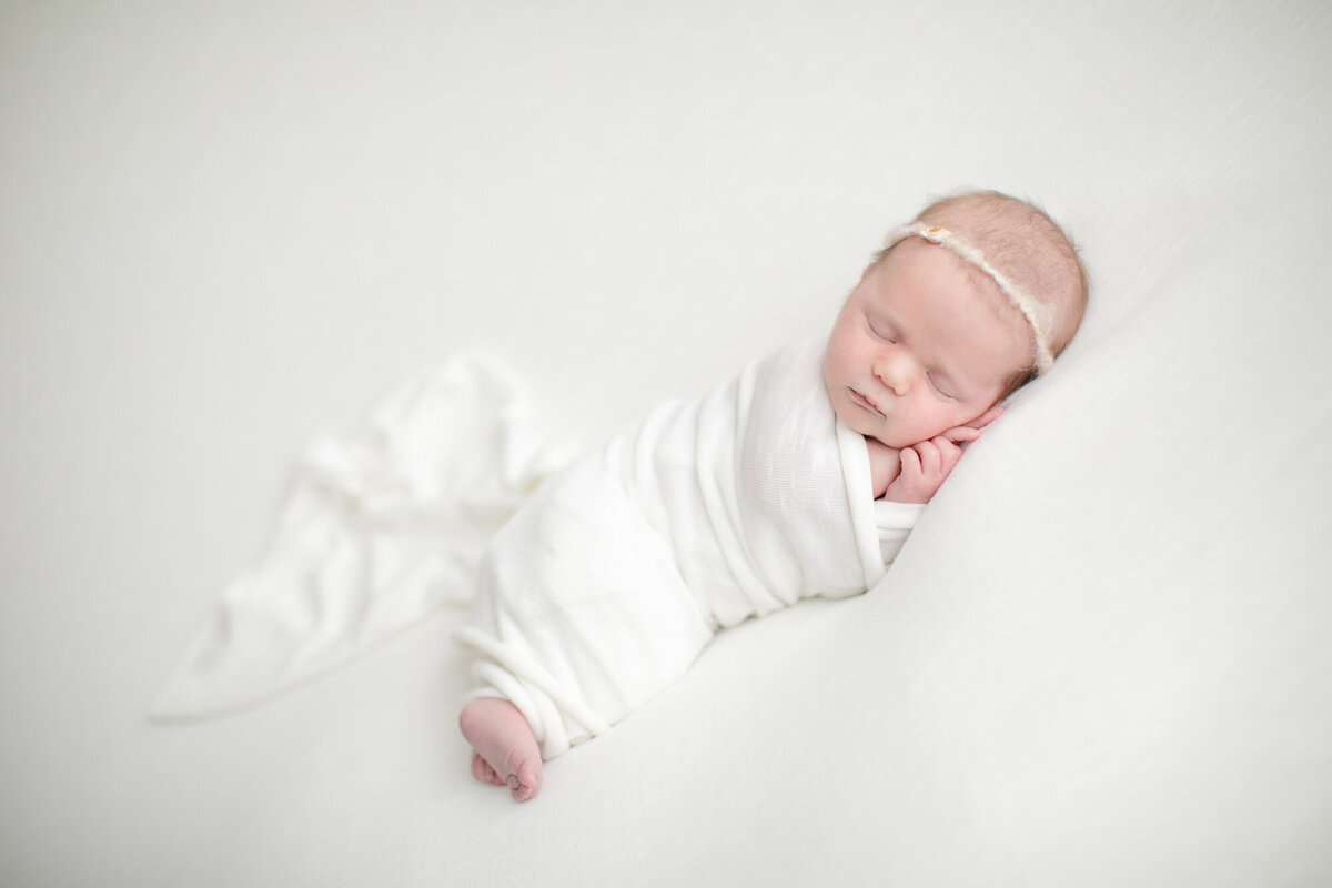 Sleeping newborn baby at Boise photo studio of Tiffany Hix Photography