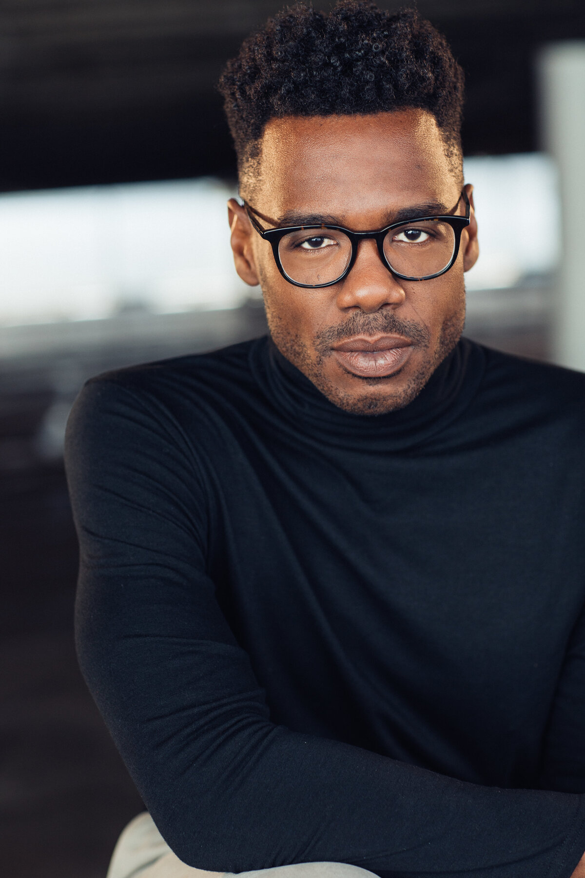Young Man Wearing Navy Blue Turtleneck and Eye Glasses Headshot in LA