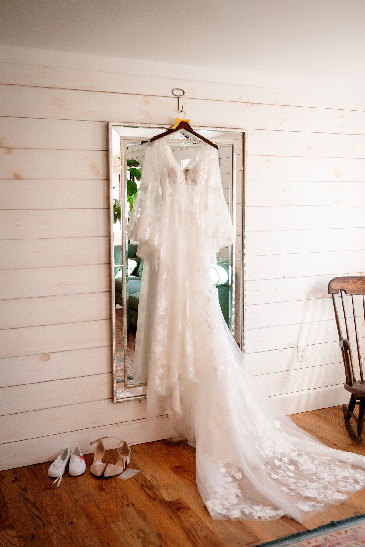 wedding dress hanging in the bridal suite at shady elms farm