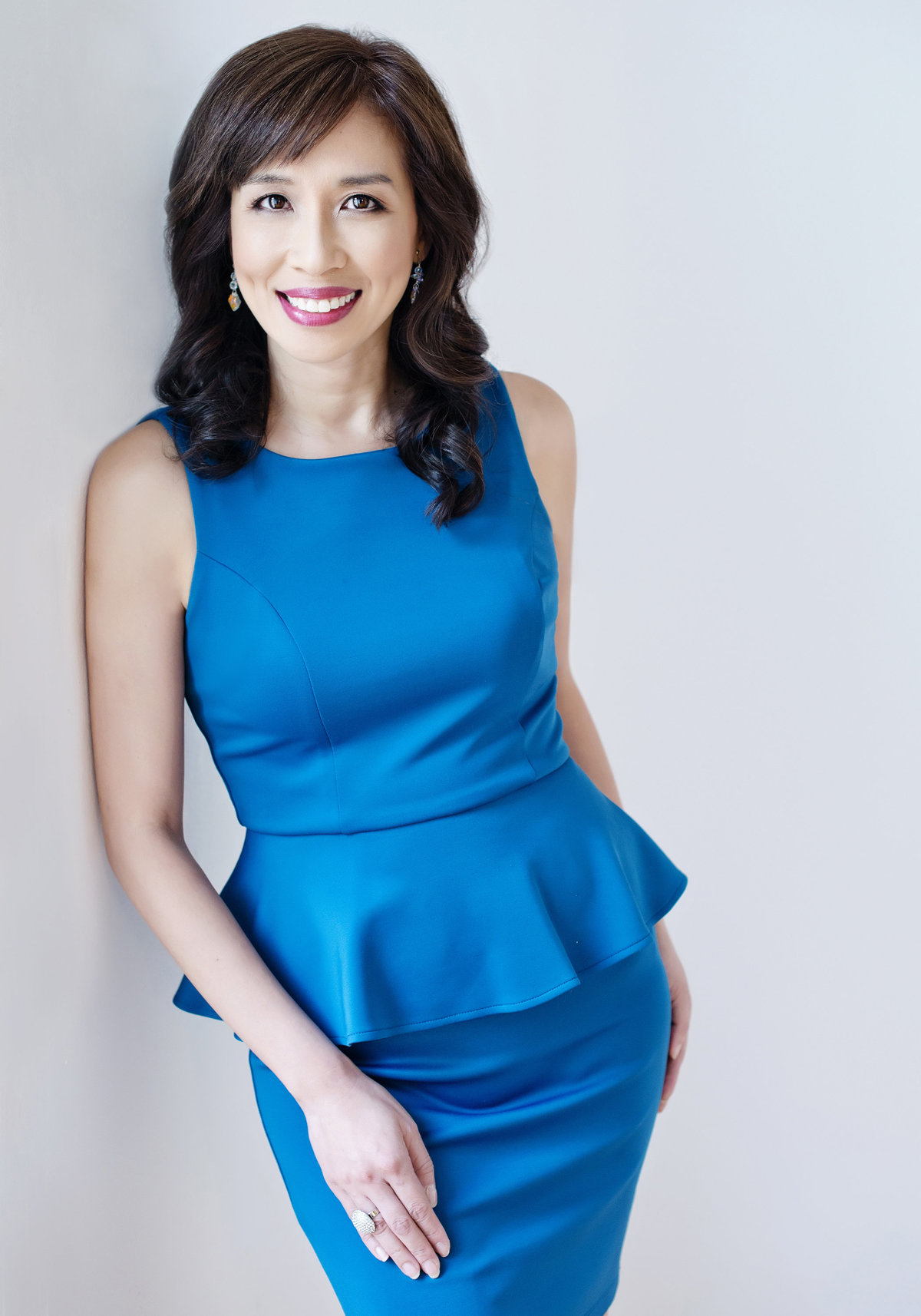 headshot taken in oakville  for  business leader real estate agent in blue dress by zoom into life  studio  warm approachable