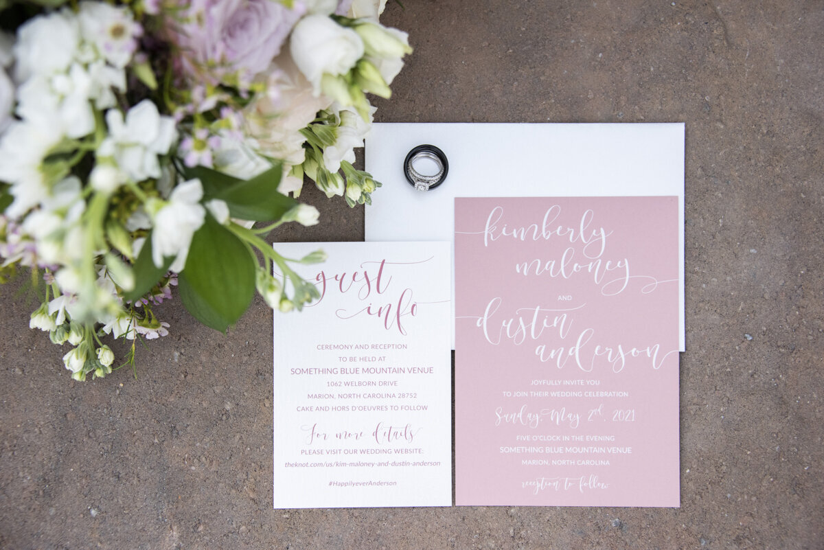 Wedding invitation and rings