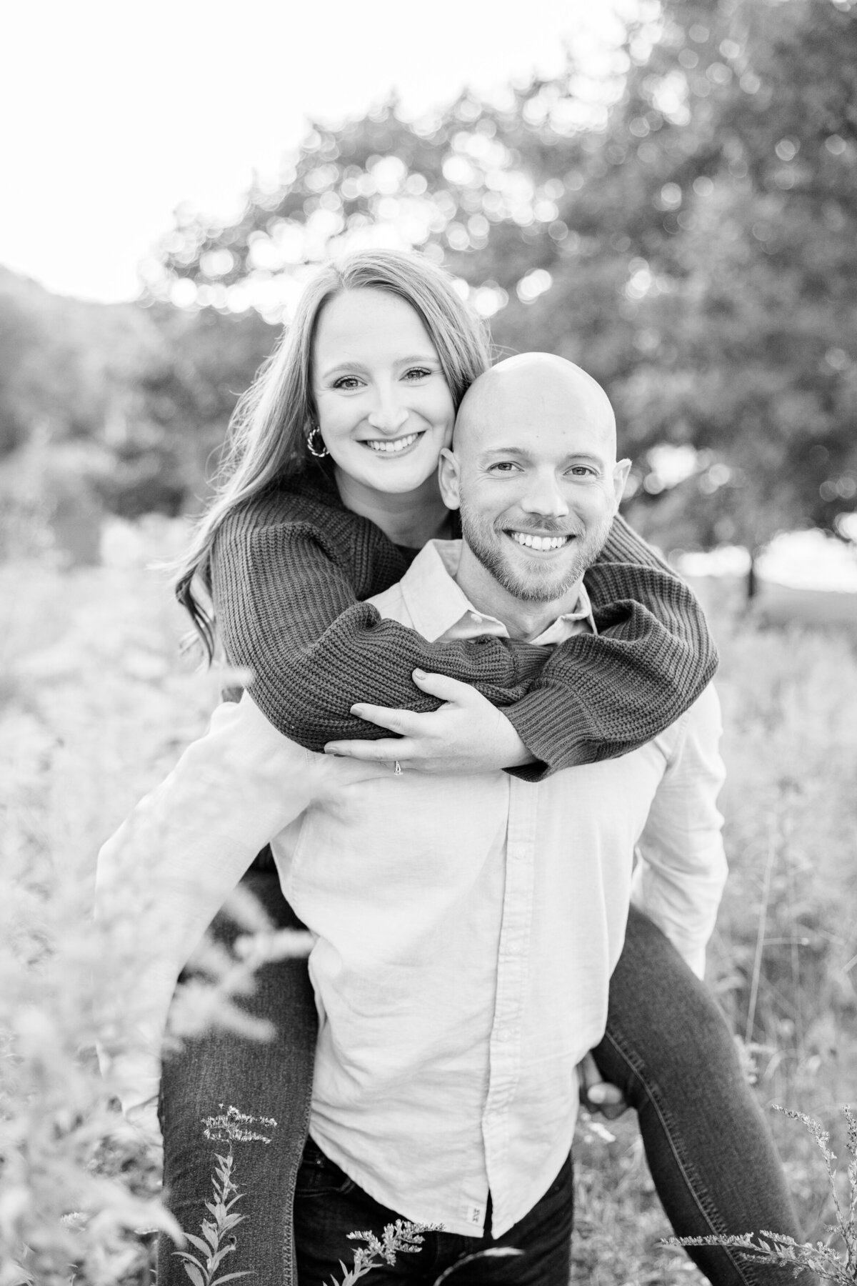 Golden hour engagement session in a field of goldenrod wildflowers