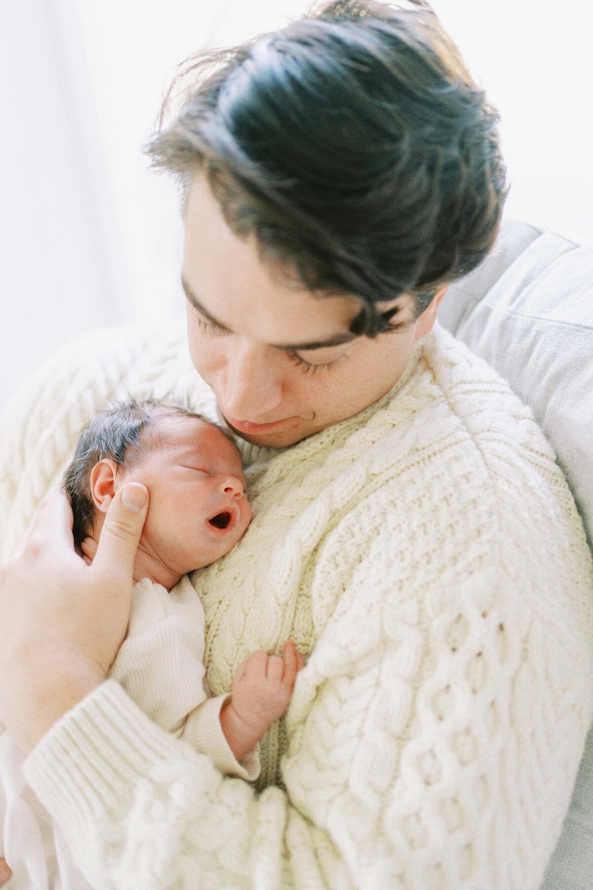 dad snuggling baby