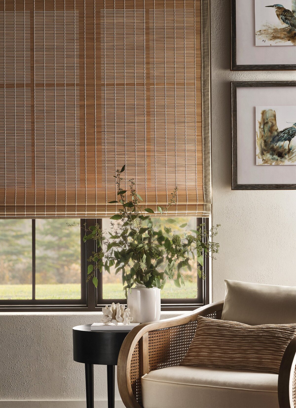 Hartmann & Forbes plank natural woven shade beside a cane chair, lifestyle photo