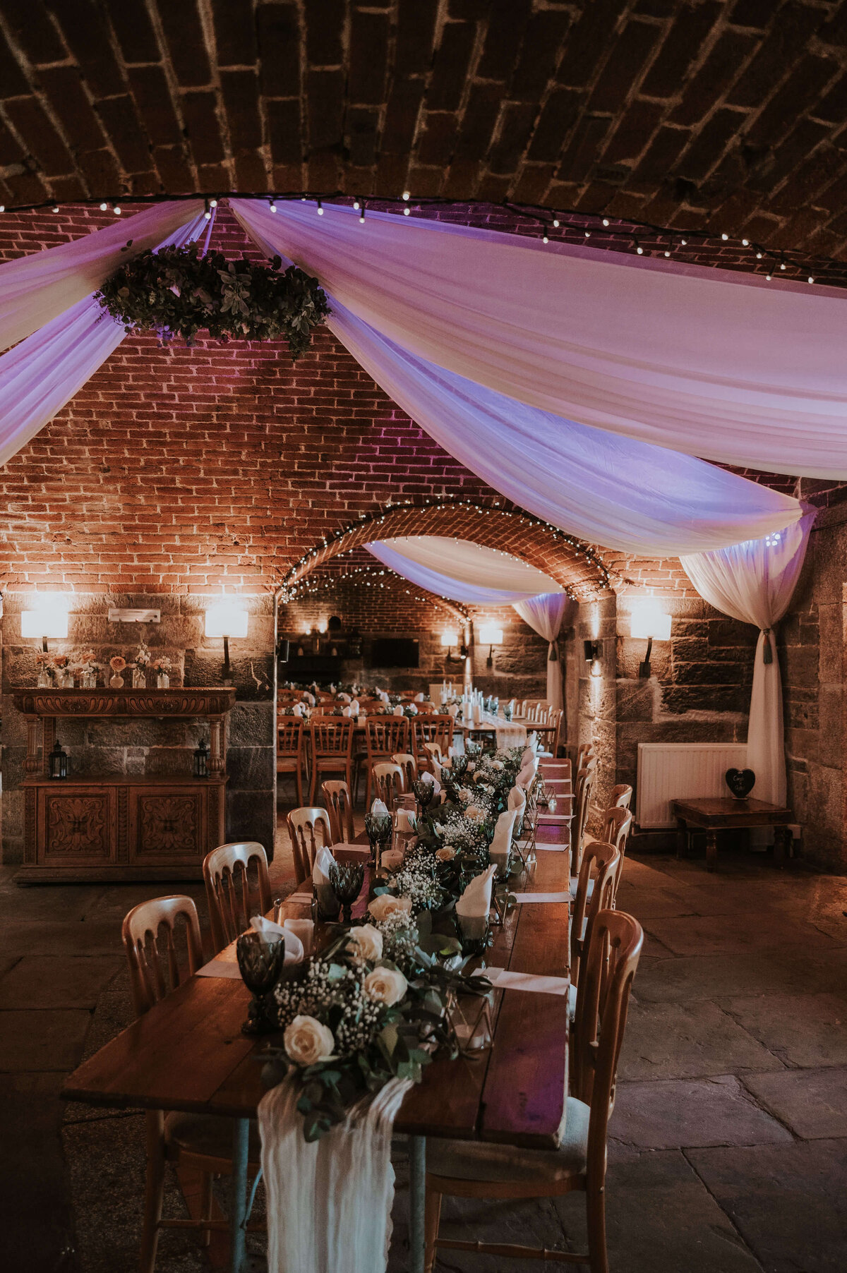 A long table set up for a wedding reception