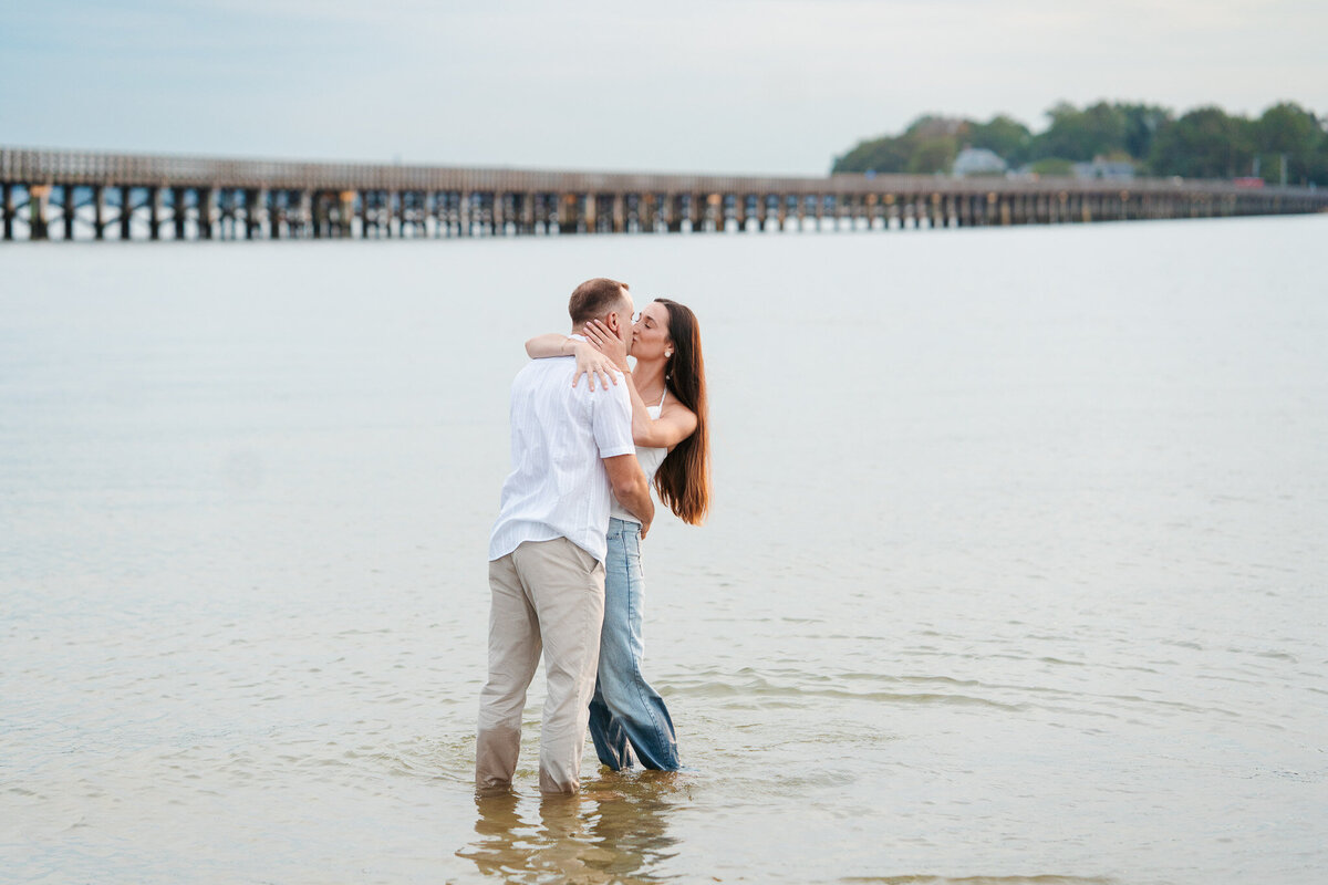 Candid ocean engagement portraits in New England with relaxed emotional storytelling