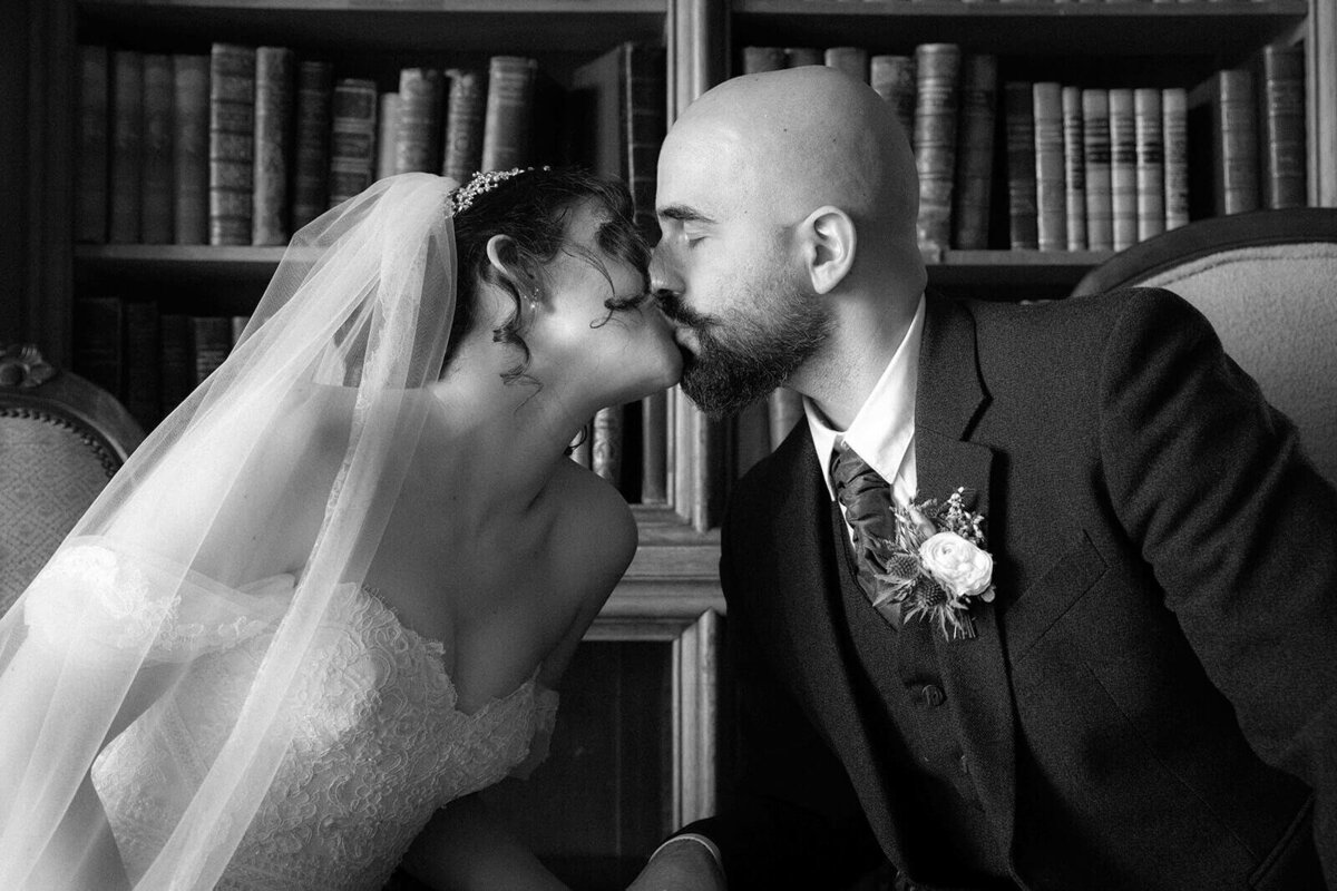 A young couple kiss , bride and groom