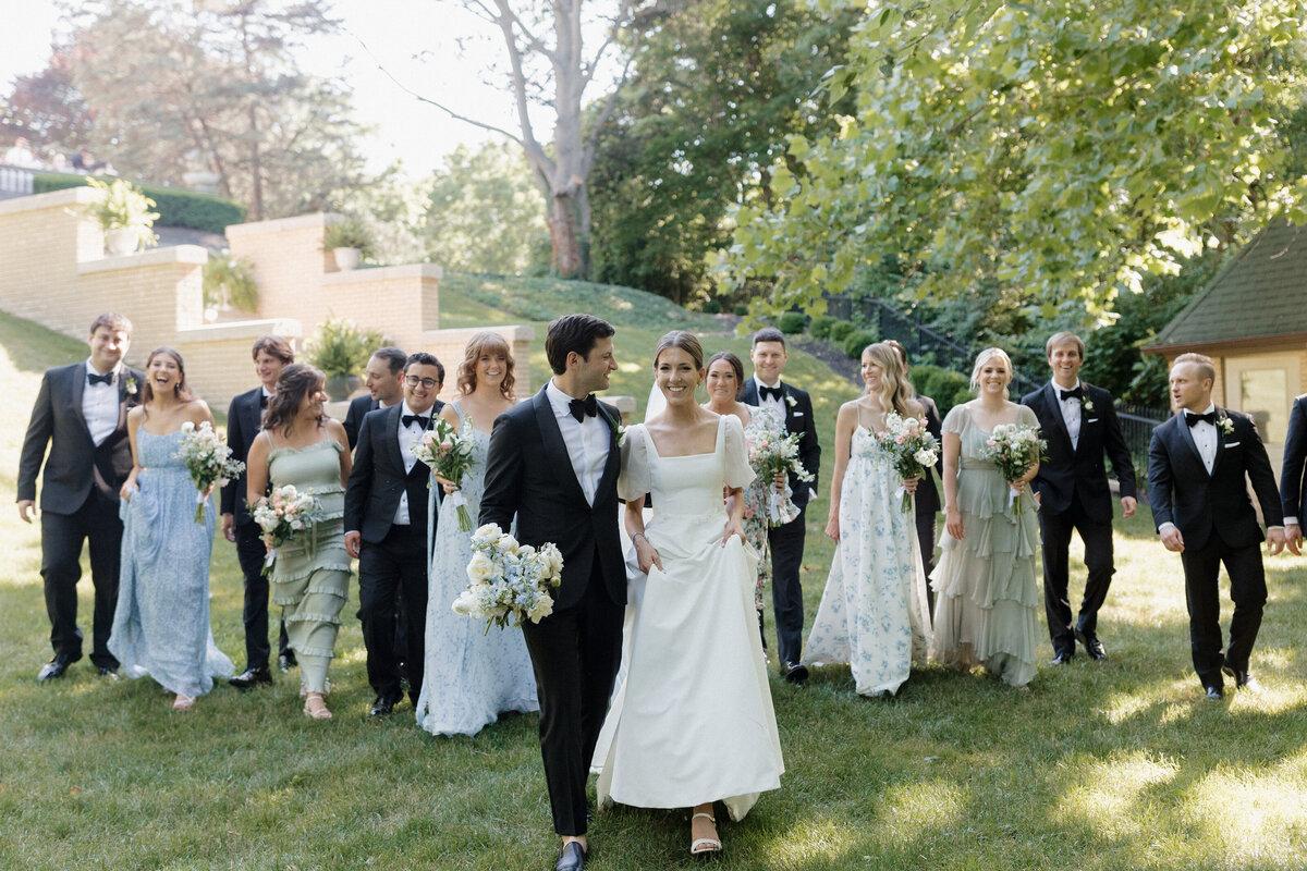 Candid Indianapolis wedding photographer bridal party walk