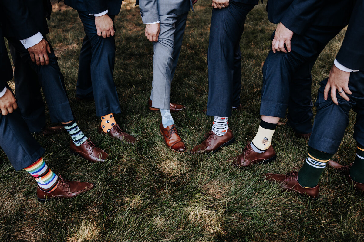 Nashville wedding photographer captures groomsmen showing socks