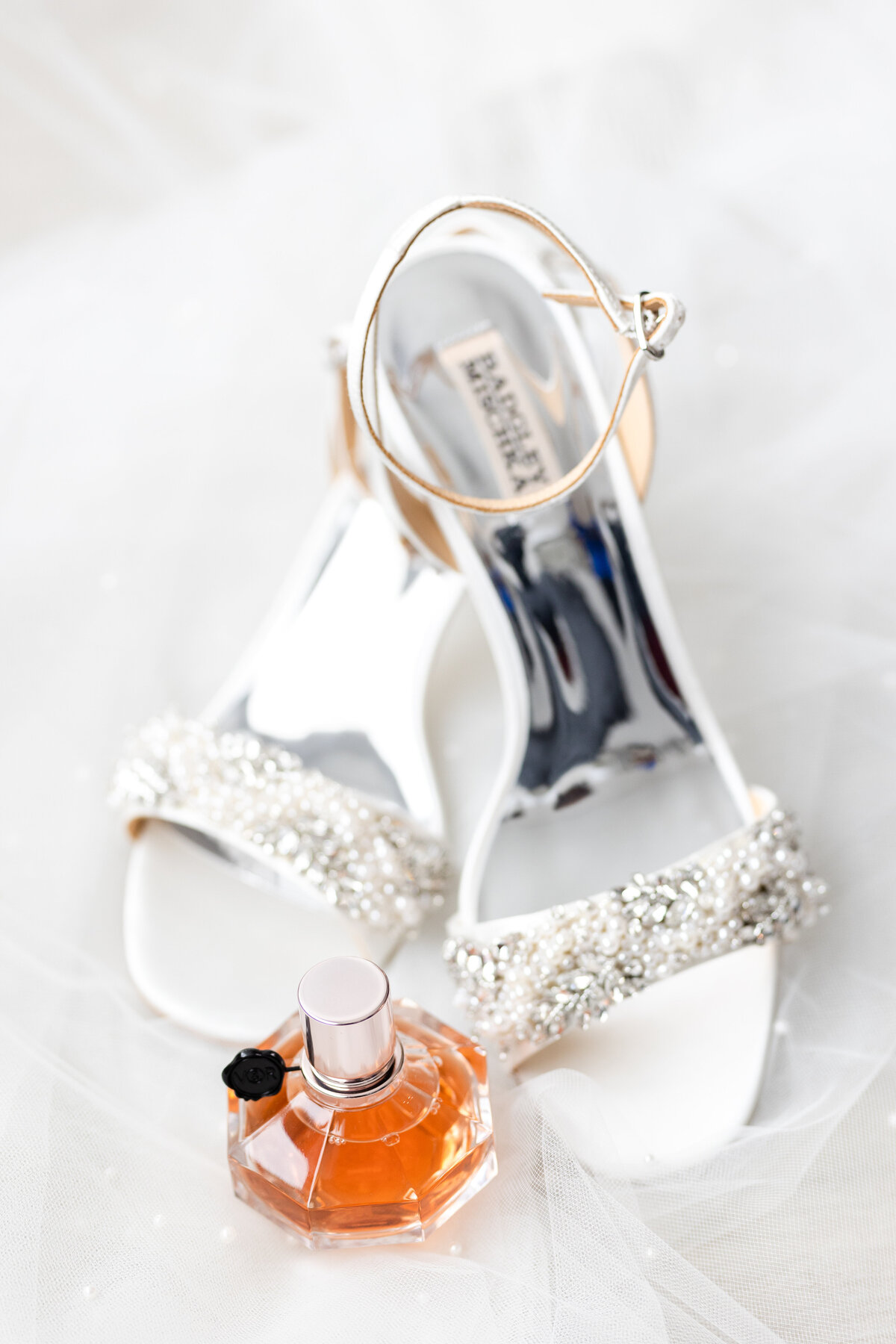 Brides Badgley Mishka shoes with a perfume bottle