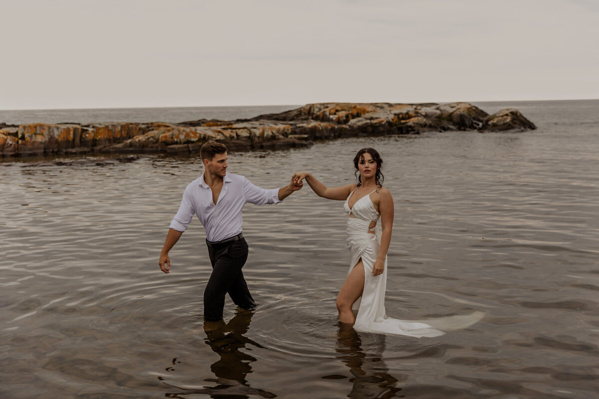 MN North Shore Elopement Bride and Groom in Lake superior photographed by Hailey Haxton a MN Destination Wedding Photographer 