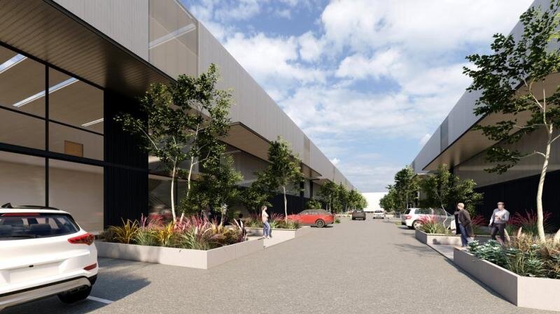 Street-level view of the completed Goodman Distribution Centre in Greenacre, featuring clean architectural lines and pedestrian access.
