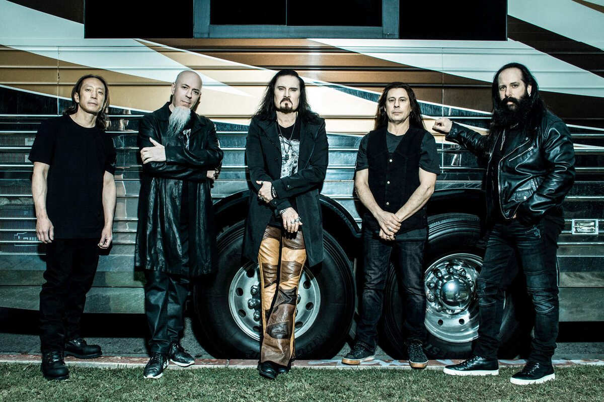 Dream Theater group portrait all five members standing along side of tour bus Roadshow Gallery