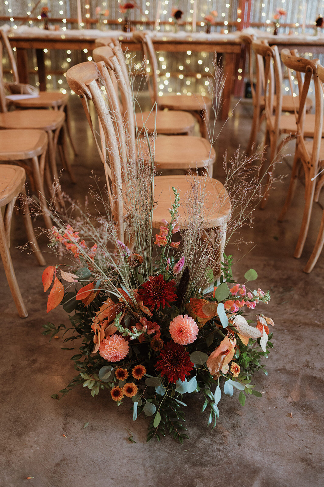 Boho wedding ceremony decor florals with vintage accents at an upstate NY winery venue

