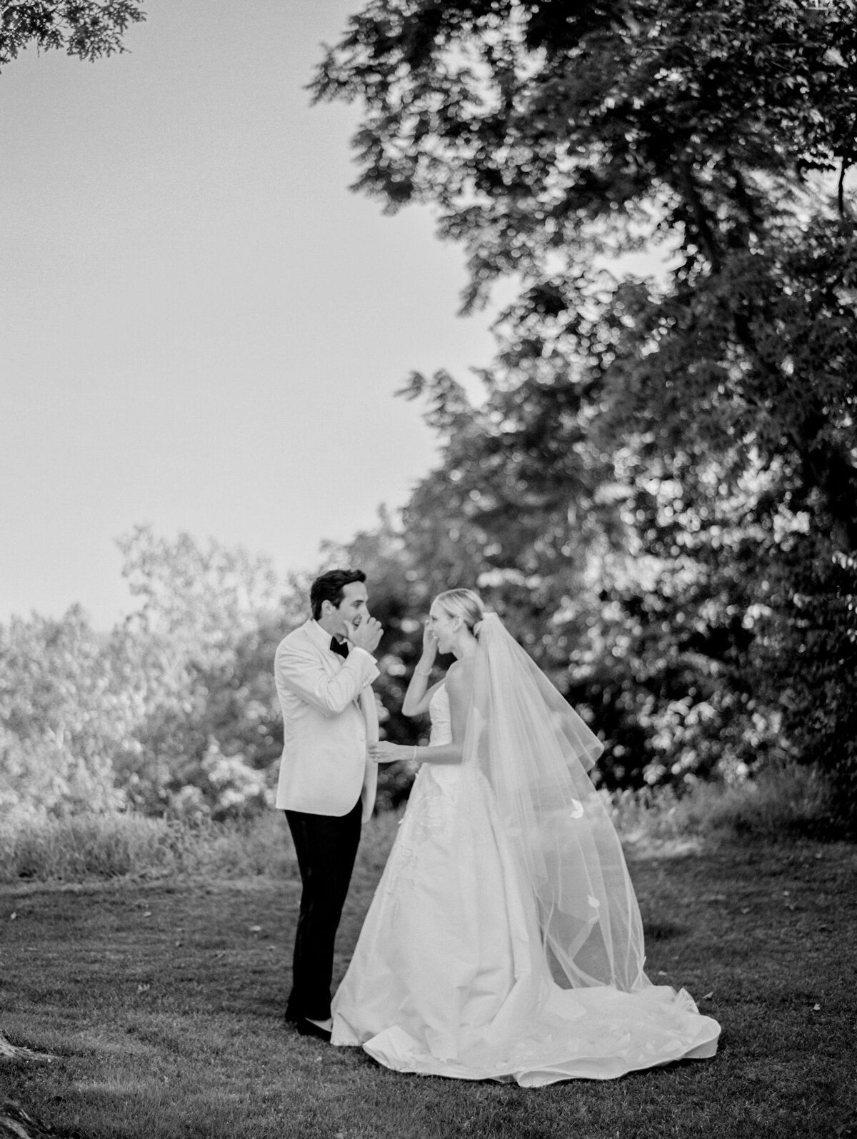 Black and white photo of the bride and groom sharing a movement at the reception. 