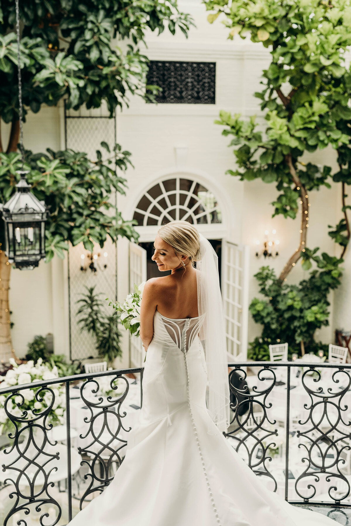 Bride posing gracefully before the ceremony, showcasing her wedding dress and radiant smile | Pittsburgh Wedding Photography