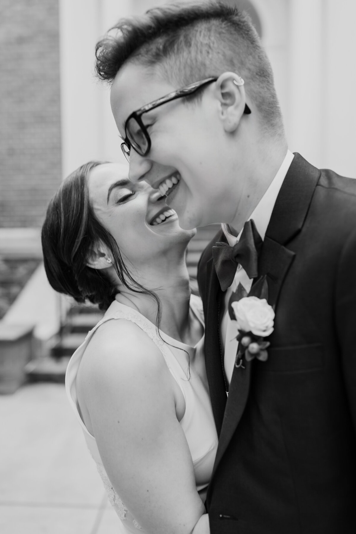 A sweet close up candid of an LGBTQ+ couple captured by Fort Worth Wedding Photographer, Megan Christine Studio