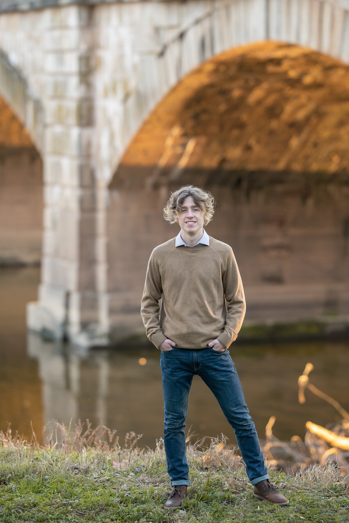 senior guy standing near bridge