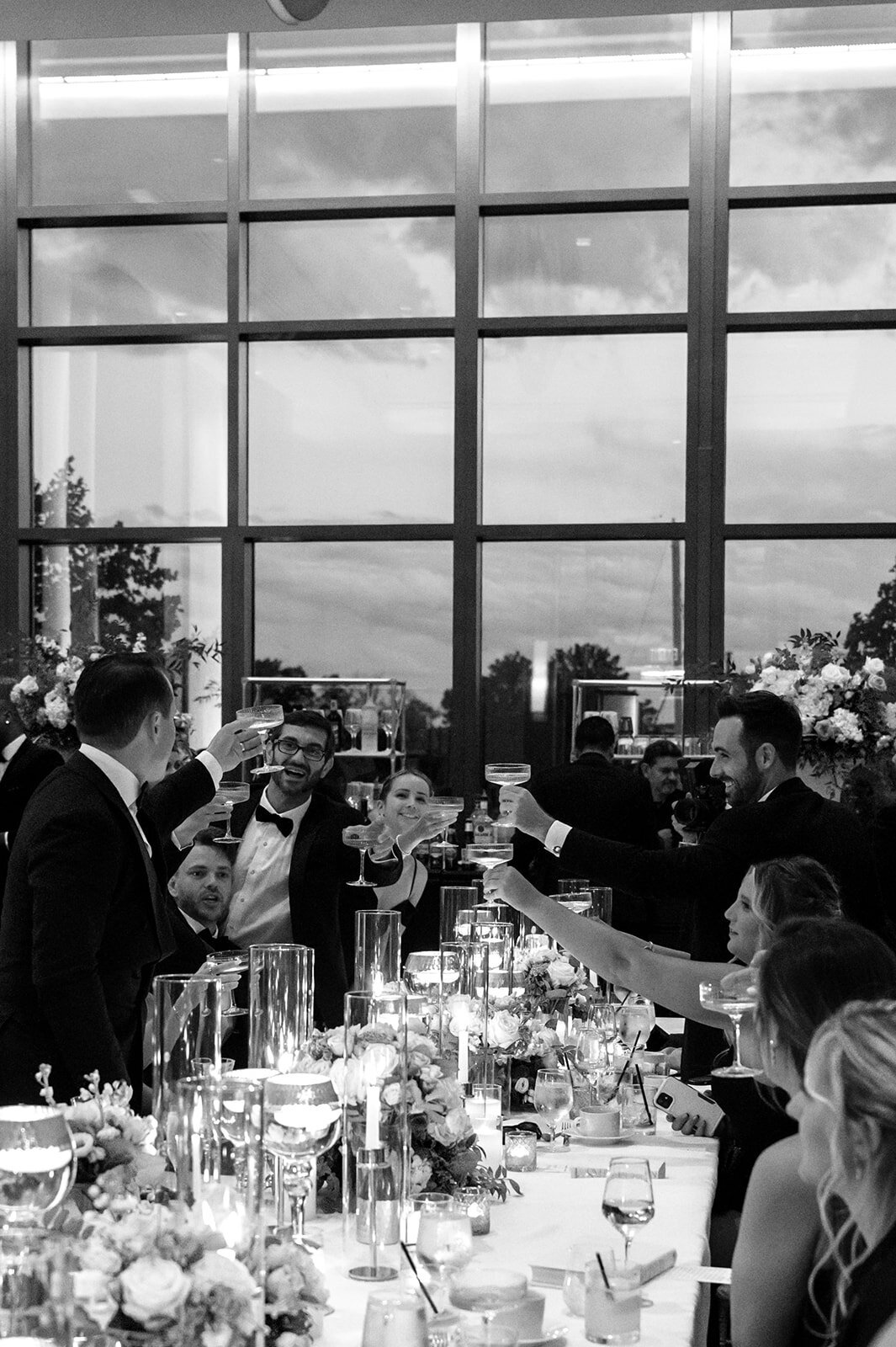 Guests clink champagne classes at DC Wharf Reception