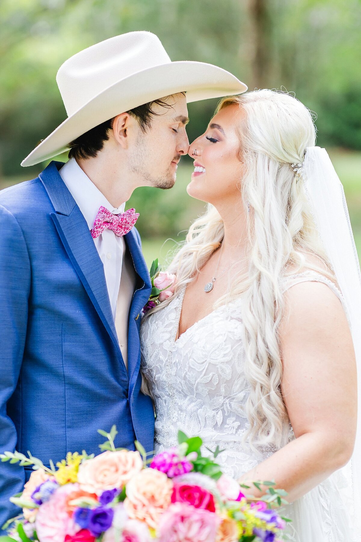 Bride with groom in blue suit  | Elms of Coosada Wedding Photographer 