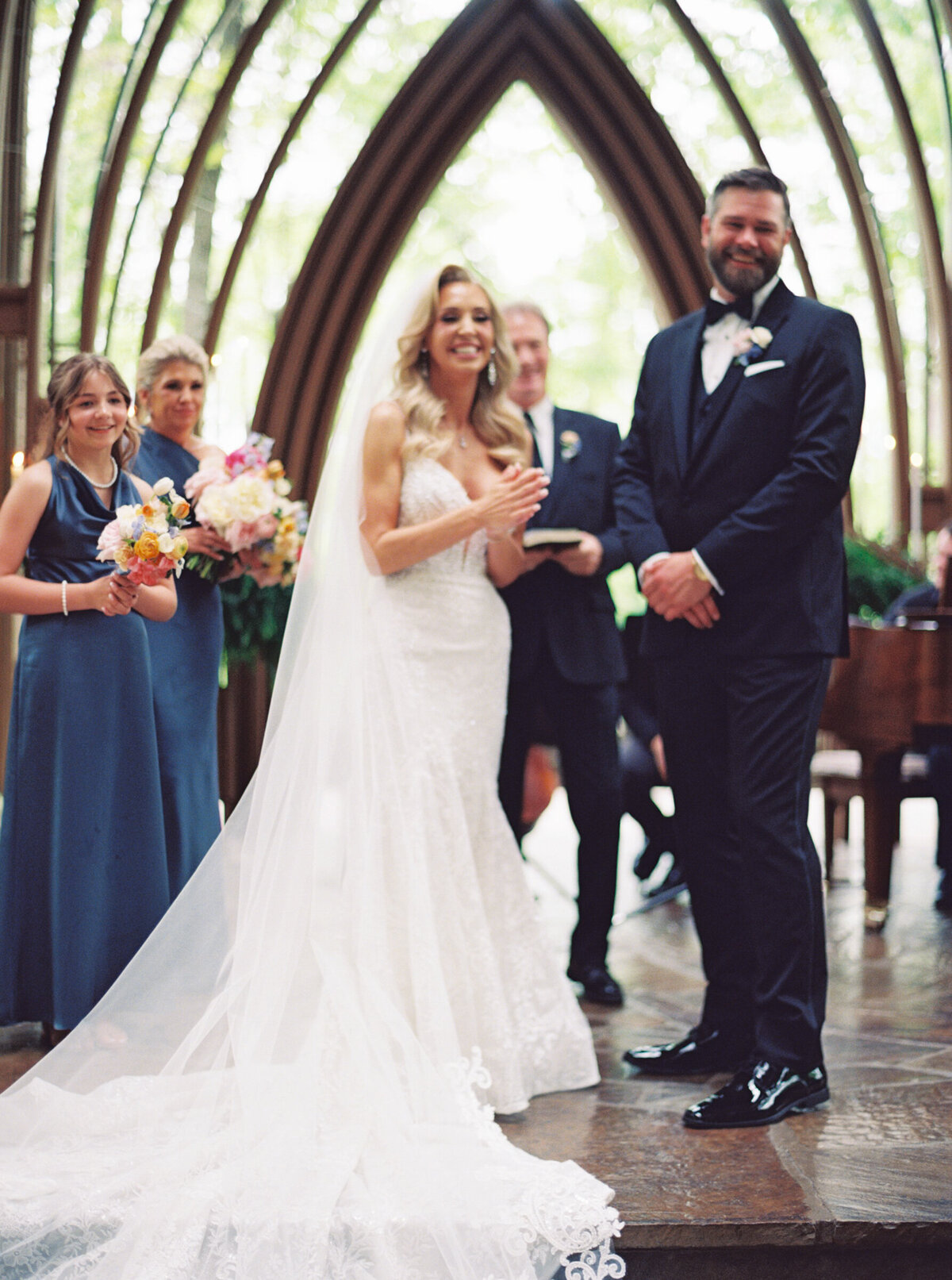 A wedding photo of the bride and groom on the alter at Anthony's Chapel in Hot Springs Arkansas