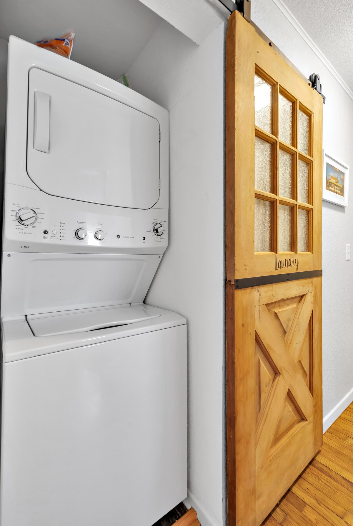 Laundry room with washer and dryer in this  three-bedroom, two-bathroom vacation rental house with free Wifi, fully equipped kitchen, office space, and room for six in downtown Waco, TX.
