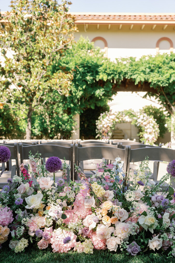 garden arrangement, beginning of aisle arrangements , pastel flowers