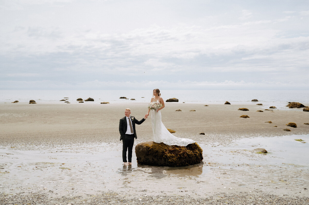Seaplane and boating elopement in BC with the bride and groom on remote beach