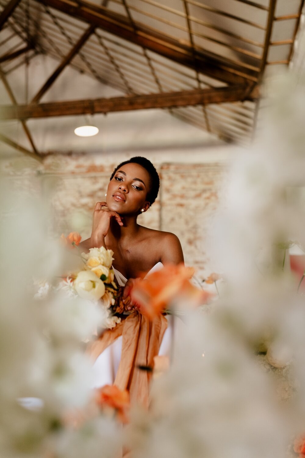 African-bride-at-orange-wedding-reception