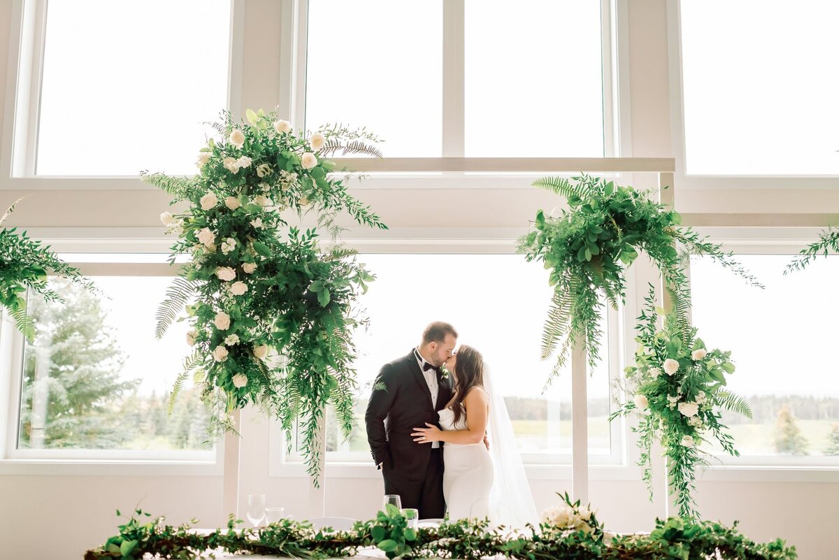 Elegant and lush greenery at Tin Roof Event Centre, a modern wedding venue in Lacombe, Alberta, featured on the Brontë Bride Vendor Guide.