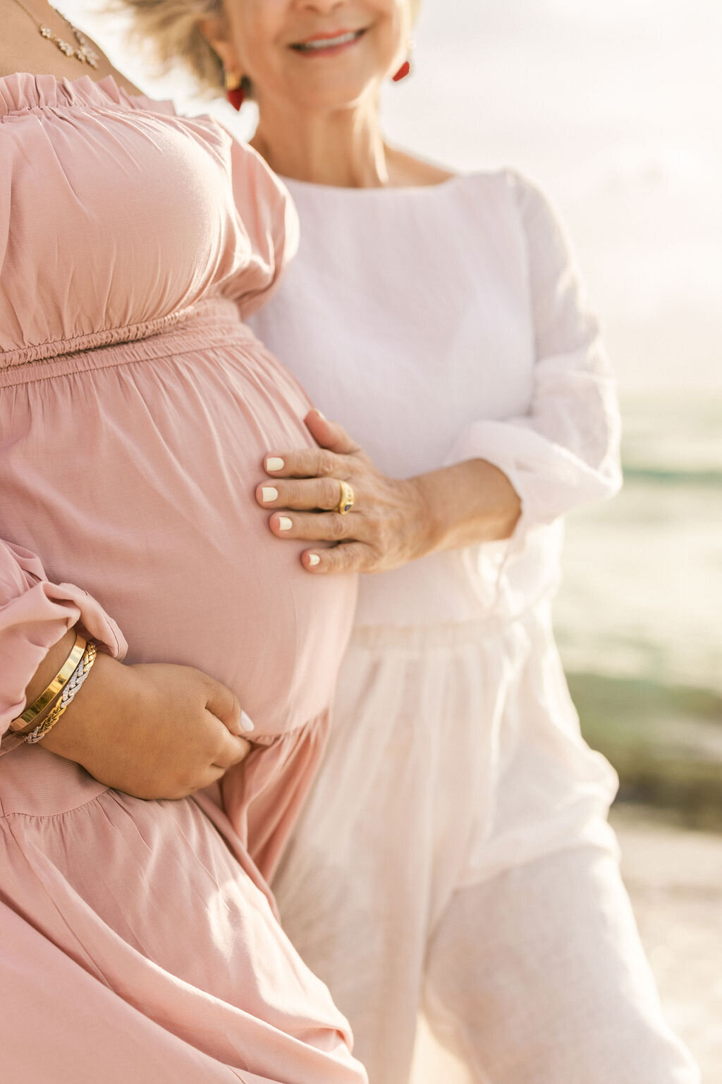 miami-maternity-beach-hands-on-belly-mother-grandmother