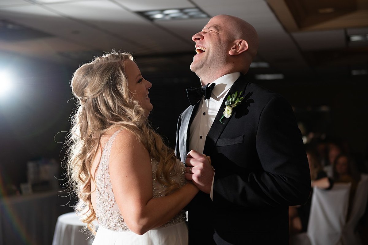 Groom laughing with Bride during First Dance